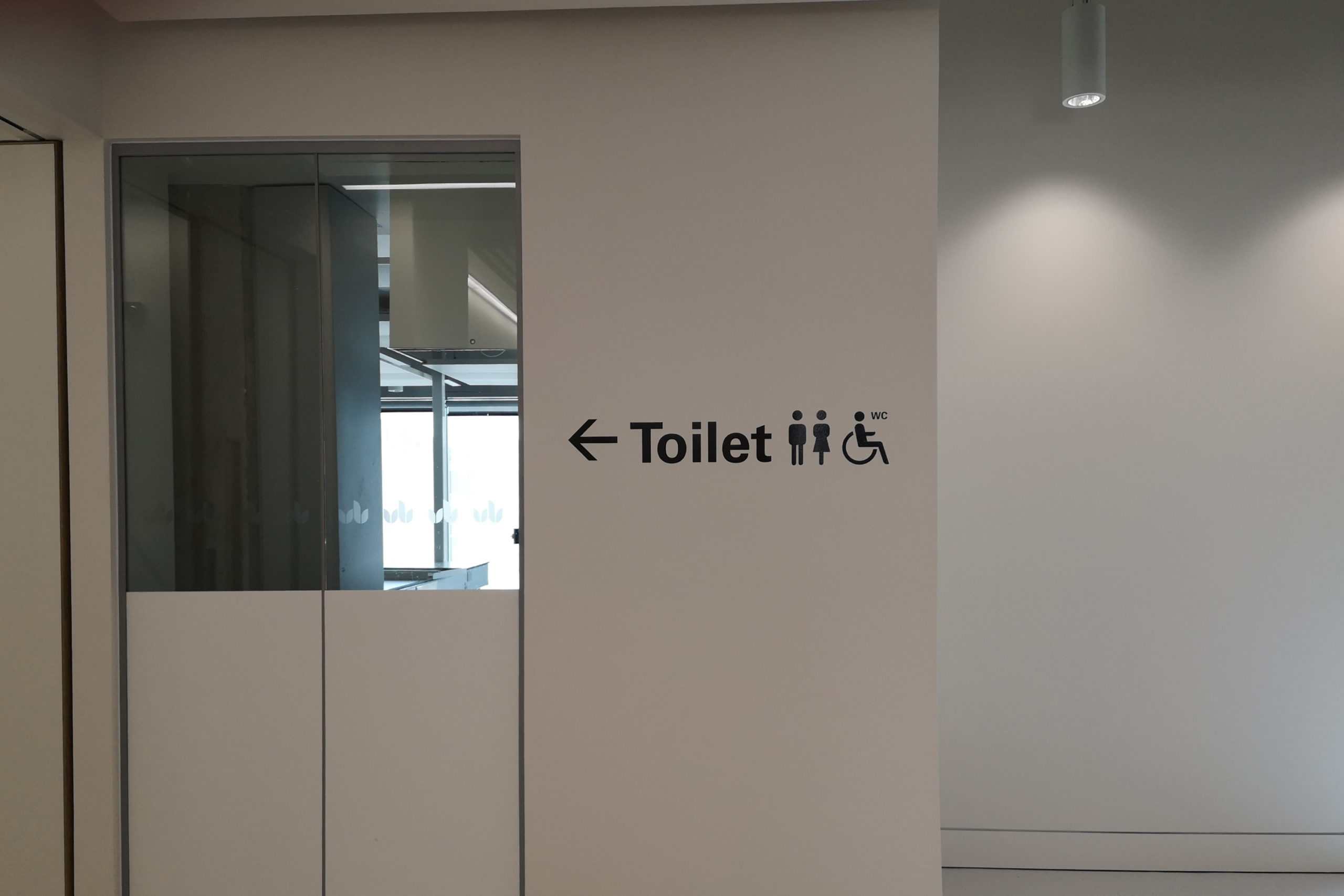 Toilet directional sign