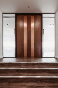 Walnut door with copper inset and privacy film