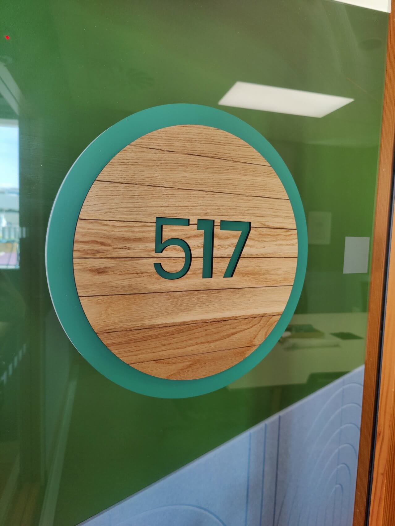 green and wooden sign